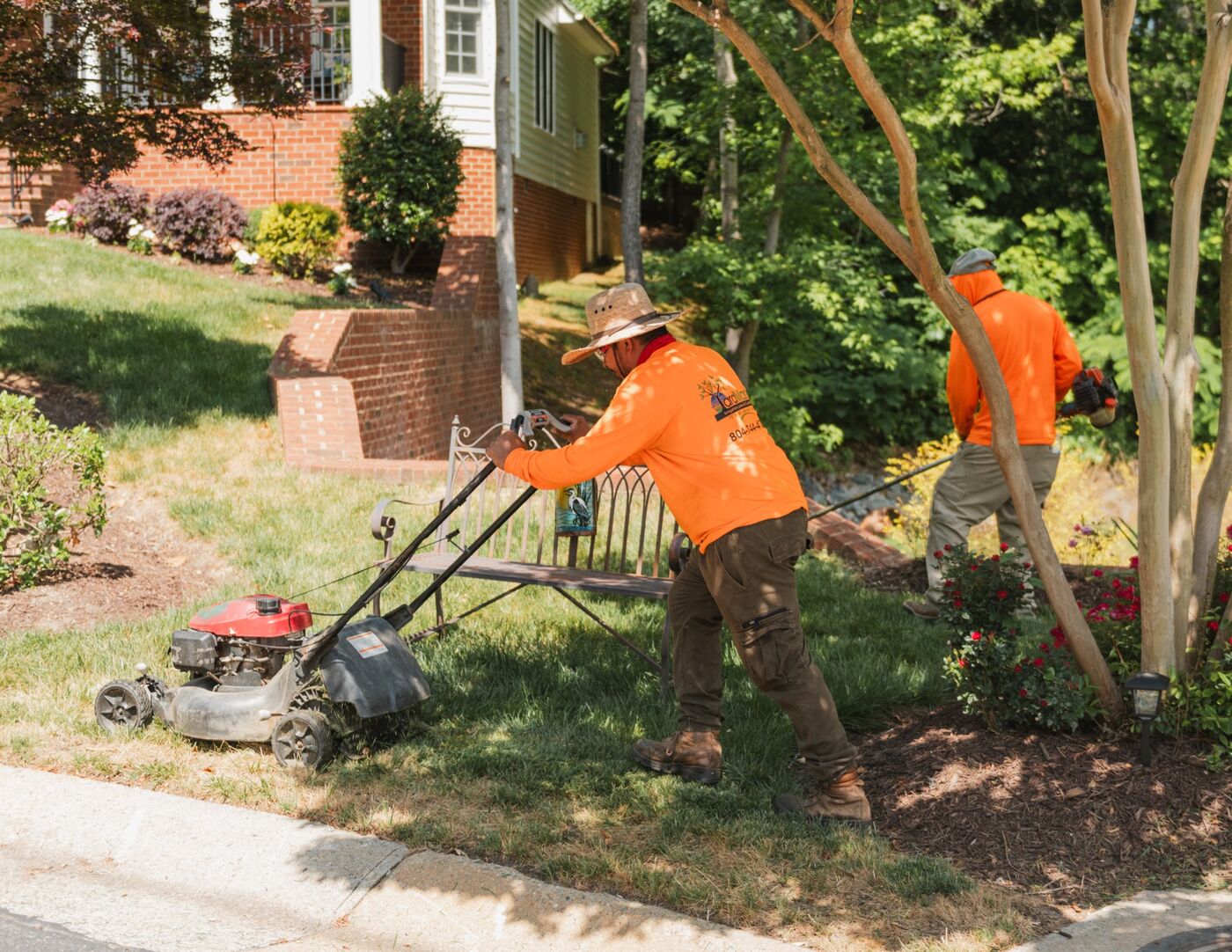 Crew member mowing