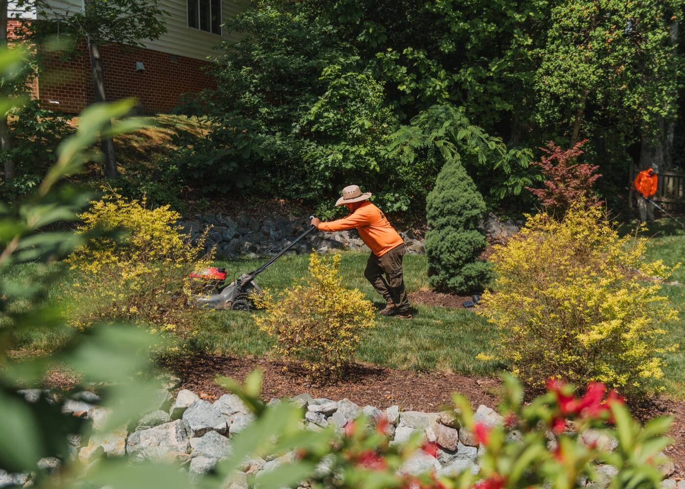 A crew member trimming inside a mixed bed in full colour